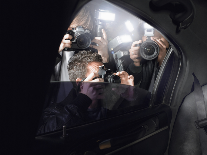 Paparazzi Shooting Through Car Window stock photo