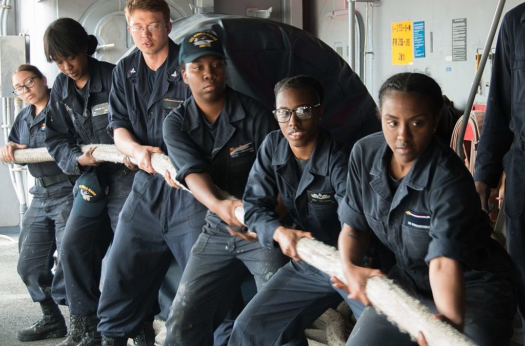 U.S. Navy sailors heave mooring line aboard USS Ronald Reagan